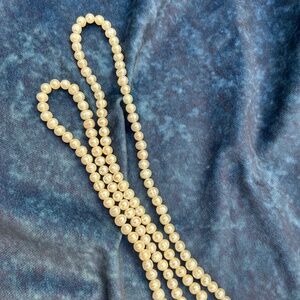 White likely freshwater pearl strand necklace